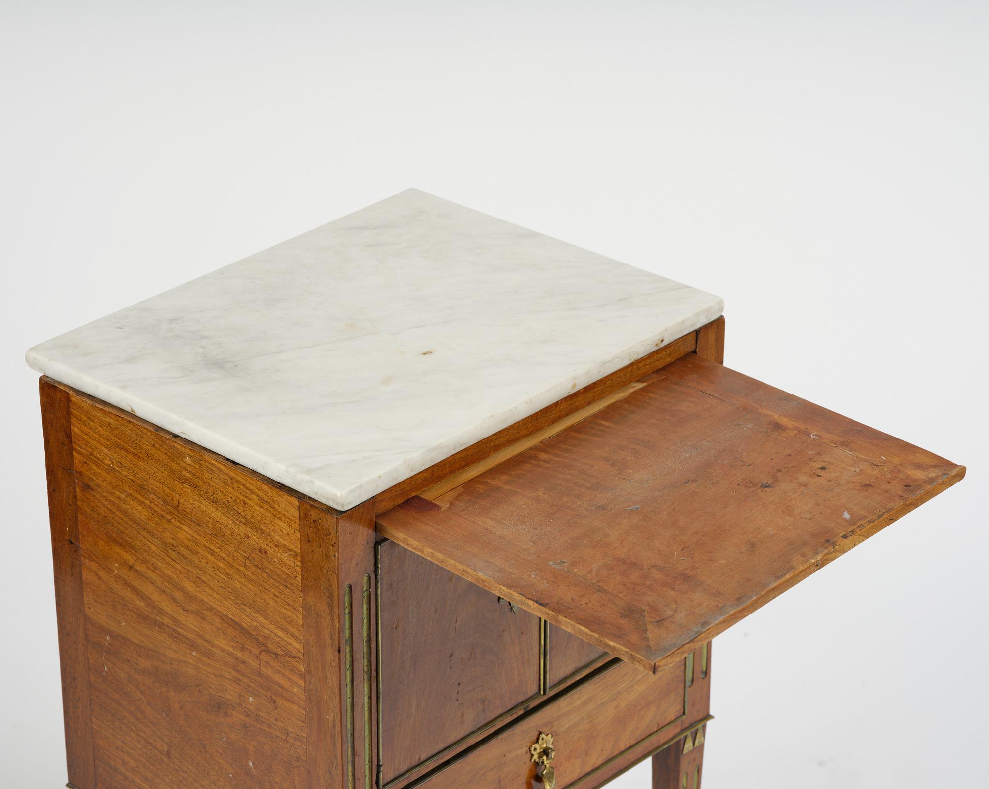 A late Gustavian mahogany chamberpot cupboard, circa 1800.