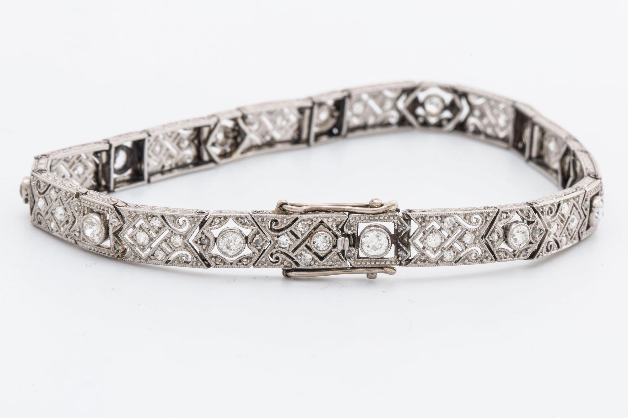 DIAMOND BRACELET, probably platinum, old and rose-cut diamonds approx 2 ct in total, 1 large stone not diamond.