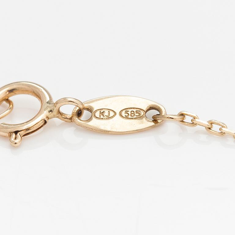 A 14K gold bracelet with a topaz. Kultajousi, Helsinki.