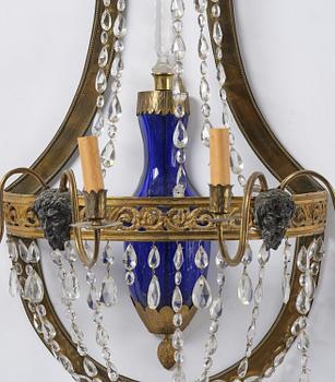 A pair of Russian Louis XVI-style  four-branch gilt bronze appliques, 19th century.