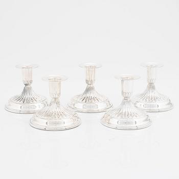 A set of five silver candle sticks by K & EC, 1956-71.