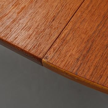 A teak dining table with 4 'Monaco' chairs, mid 20th century.