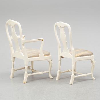 A dining table and six chairs, rococo style, mid 20th century.