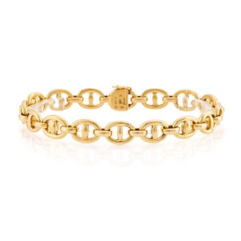 561. An 18K gold Cartier bracelet.