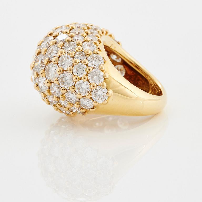 Cartier "Marrakech" an 18K gold bombé ring set with round brilliant-cut diamonds.