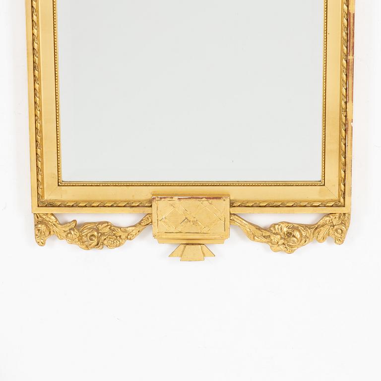 A Gustavian style console table and mirror, mid 20th century.