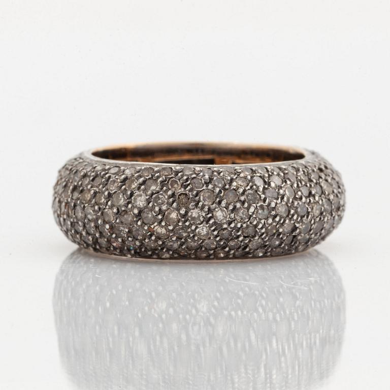 Silver and diamond ring.
