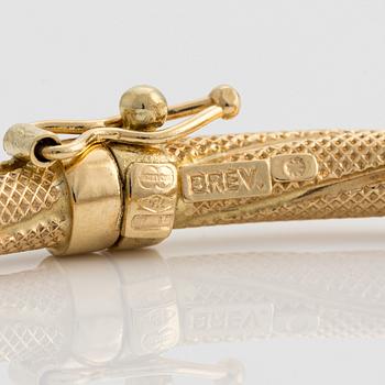 Armring, 18K guld, vriden dekor, Uno A Erre, Italien.