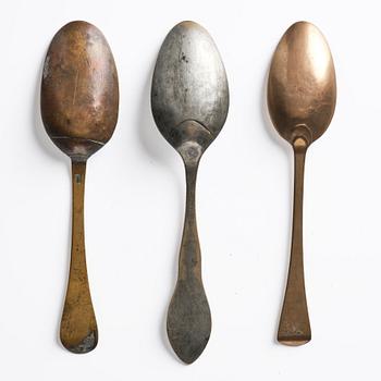 A set of three brass spoons, 18th century.