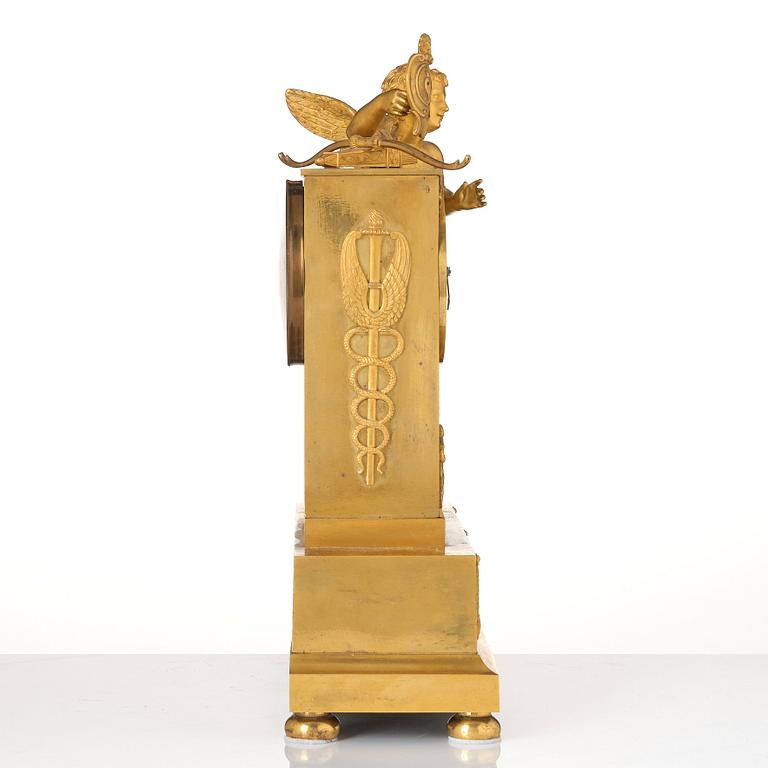 An Empire ormolu figural mantel clock, early 19th century.