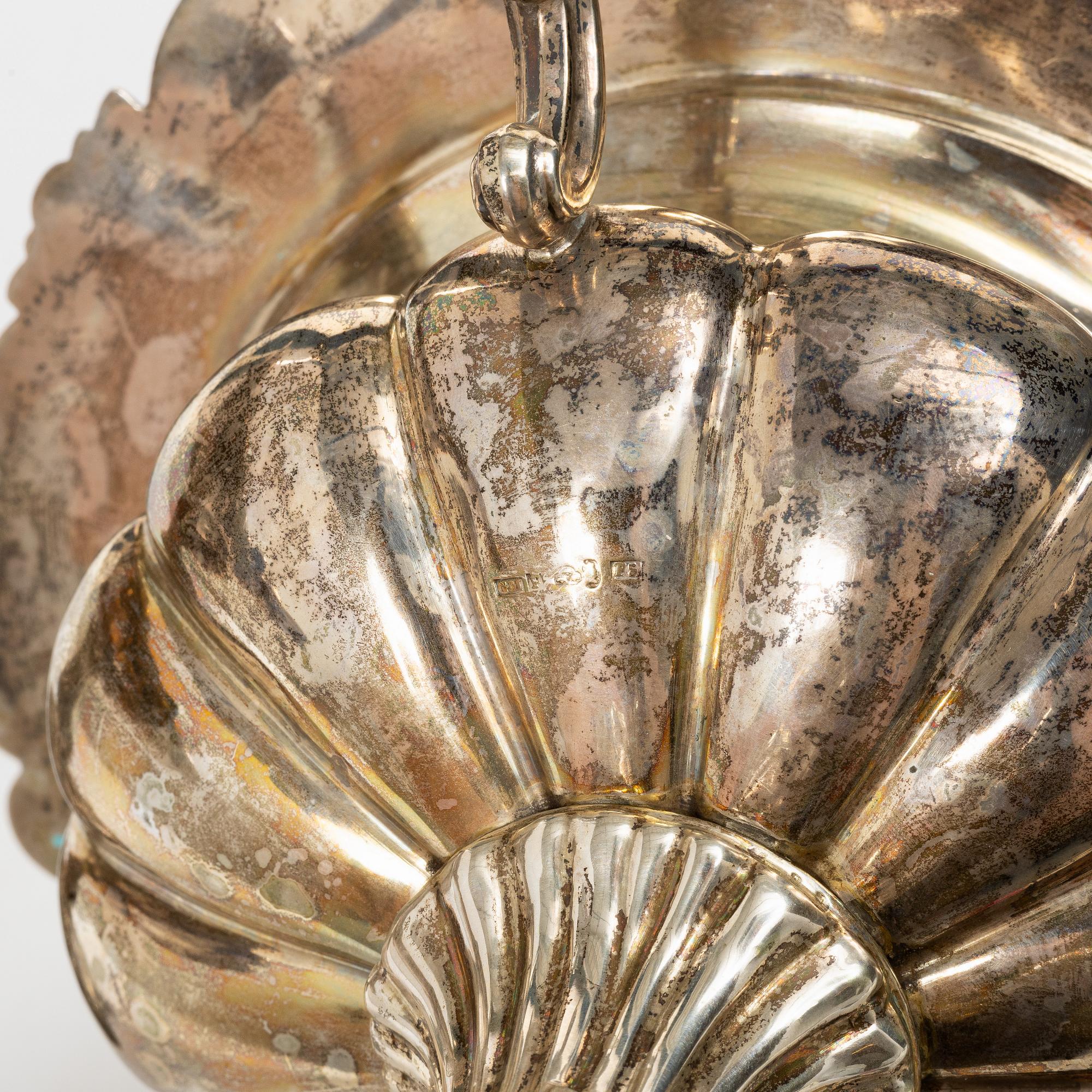 A Swedish silver sugar bowl and a centerpiece bowl, marks of G Möllenborg (Ferón) and C Hammer, Stockholm 1850-1860.