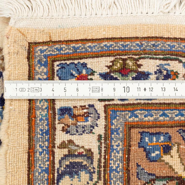 An oriantal carpet, c. 295 x 205 cm.