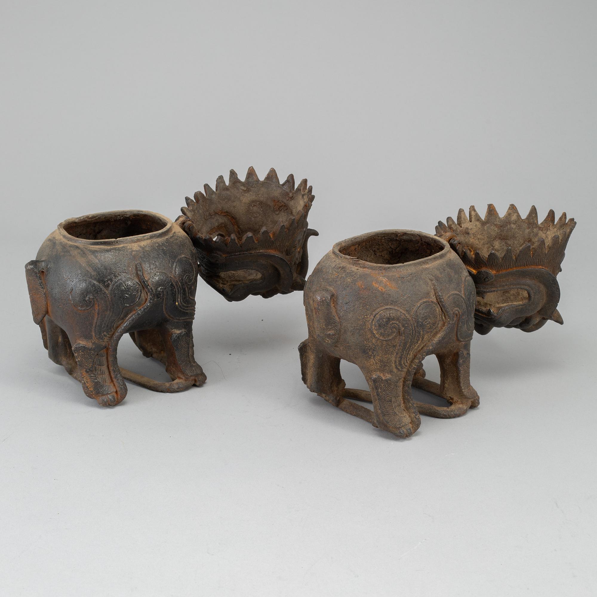 A pair of Chinese iron Fo dogs, 20th Century.