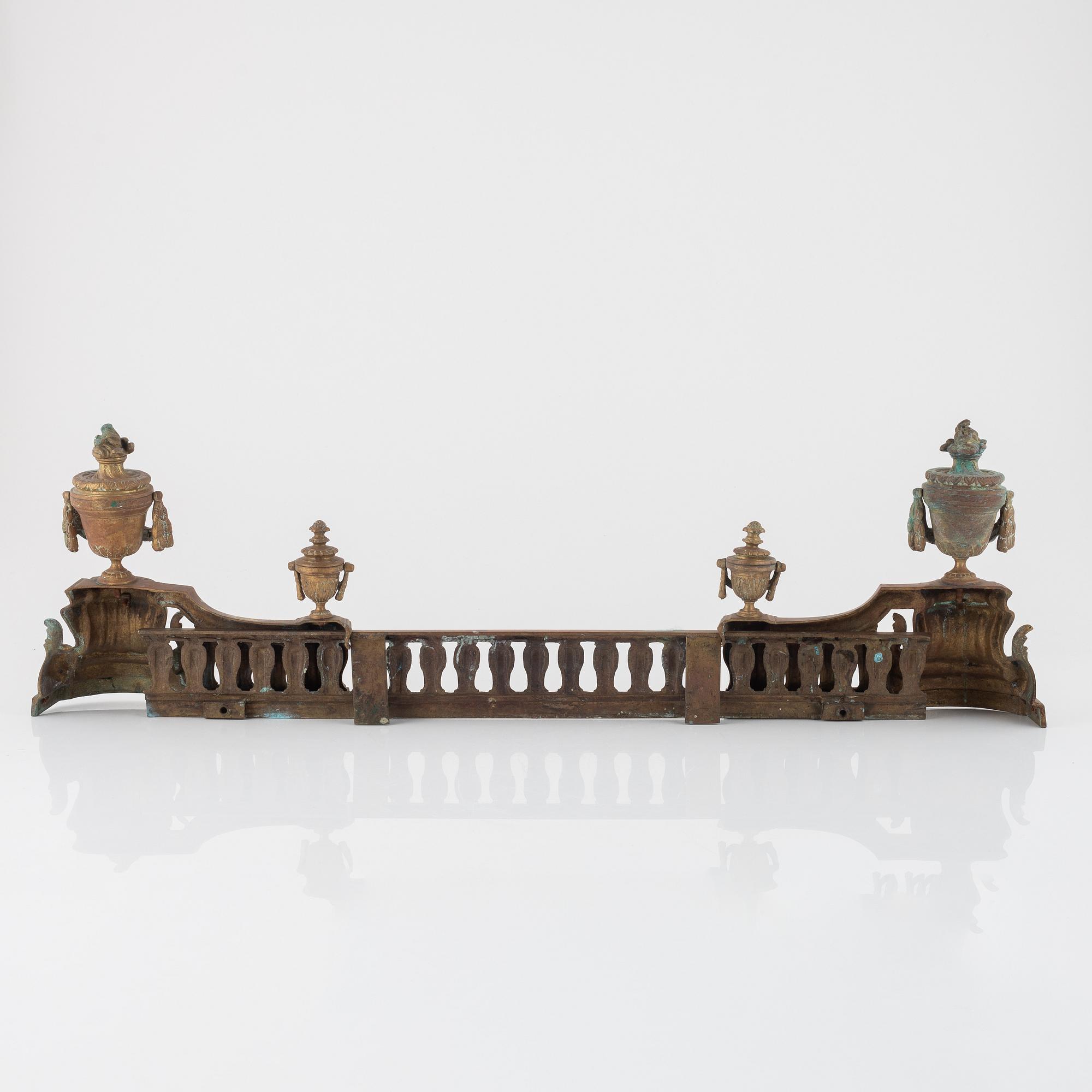 A Louis XVI style bronze grate, 19th Century.