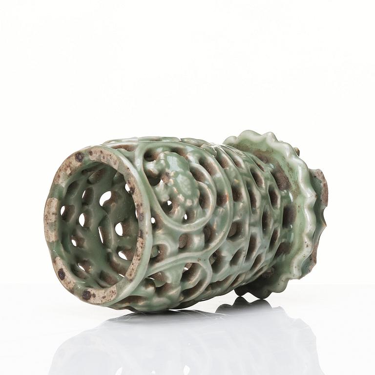 A reticulated lonquan celadon vase/candle holder, Ming dynasty (1368-1644).