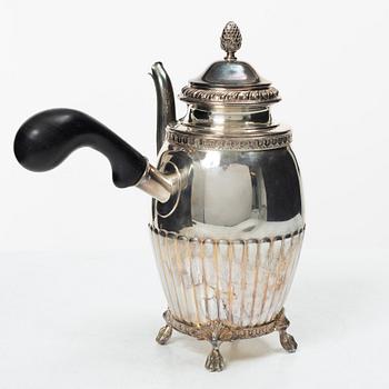 A Swedish silver coffee pot, cream jug and sugar box, Gustavian style, mark of AG Dufva, Stockholm 1911-1912.