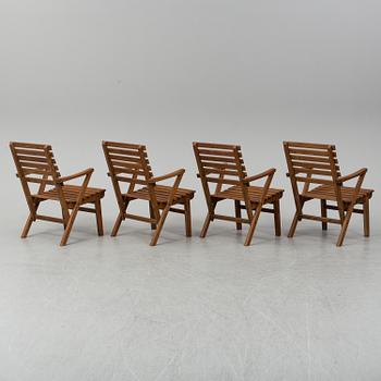 A Carl Malmsten "Bergshamra" garden table and four chairs, first half of the 20th century.