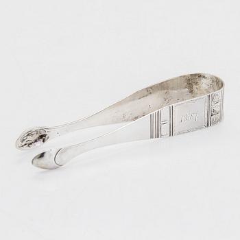 Cream jug, cake server, and sugar tongs in silver, Finland from latter part of the 18th century to 1854.