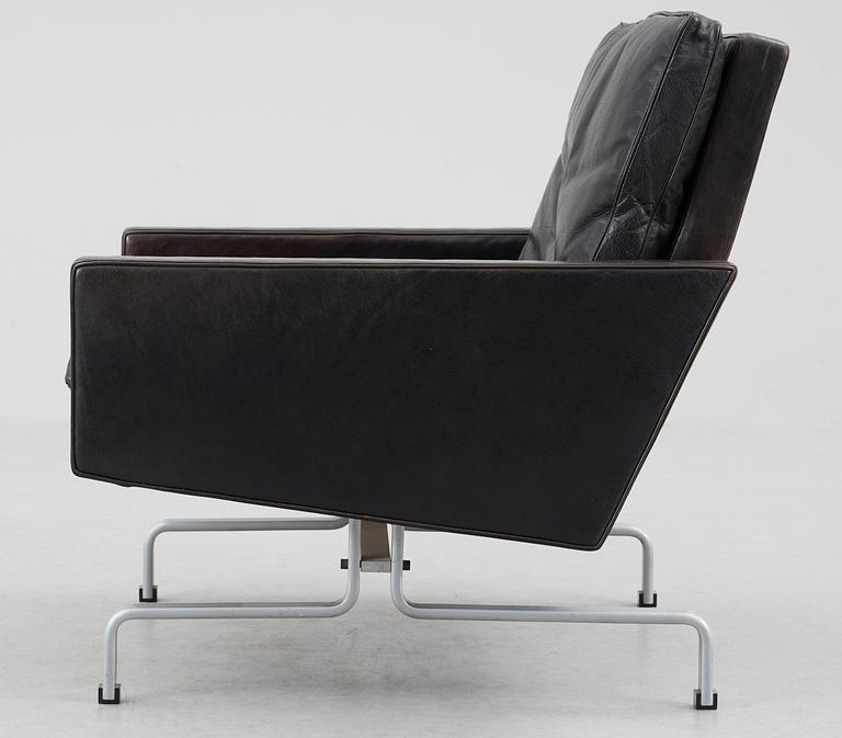 A Poul Kjaerholm 'pk-31' black leather easy chair for E Kold Christensen, Denmark, maker's mark in the steel.