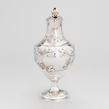 A George III sterling silver ewer by John Scofield, London, 1787.
