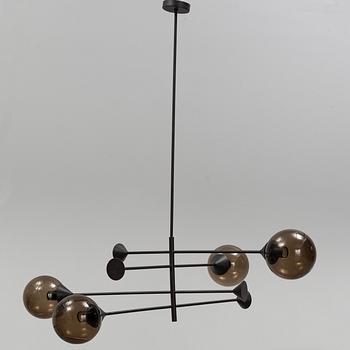 A 21st century "Kendama" LED pendant lamp, design Massimo Zazzeron, Giorgetti.