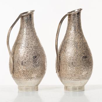 A pair of jugs, silver, Pakistan, mid-20th century.