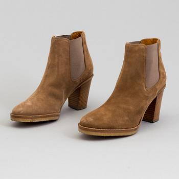 A pair of suede bootie byRalph Lauren.