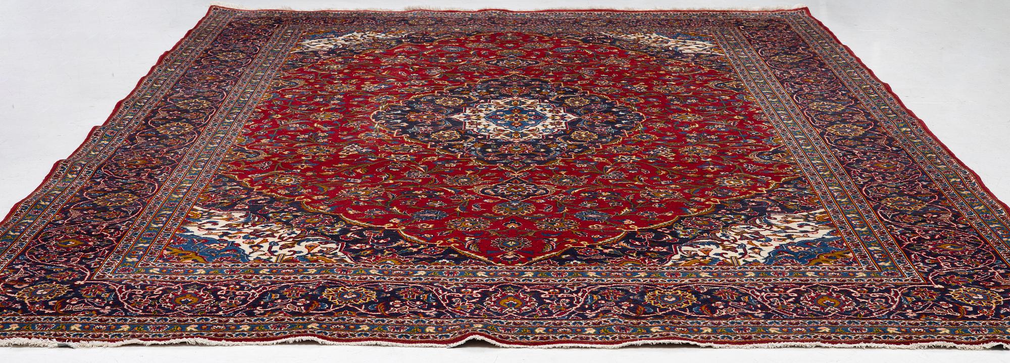 An Oriental carpet, c. 396 x 300 cm.