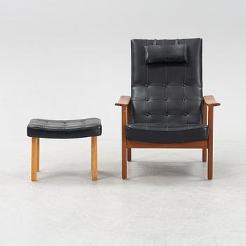 A 1970's teak and pvc coated fabric armchair and stool.