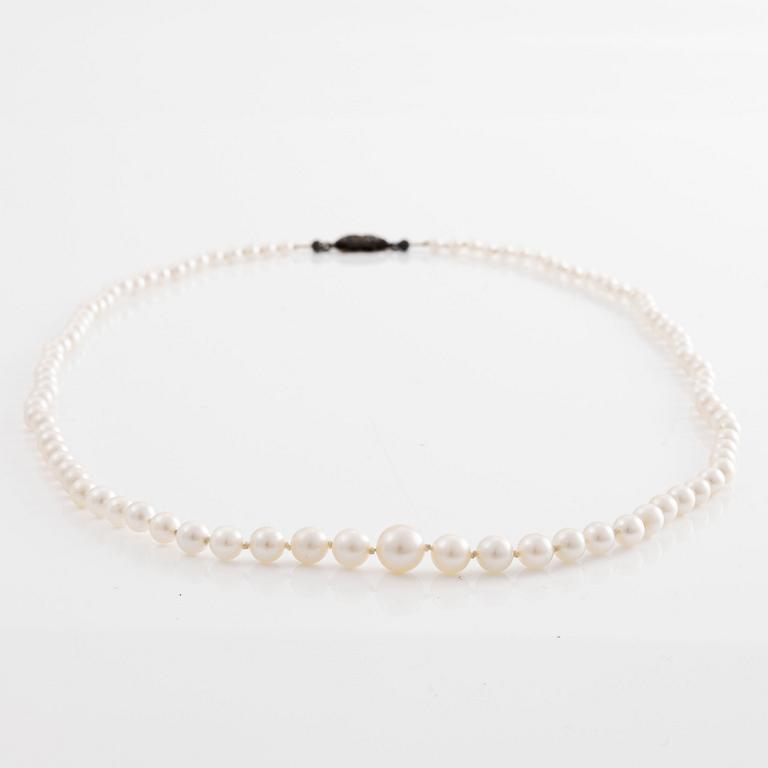 A necklace of cultured pearls clasp with old-cut diamonds.