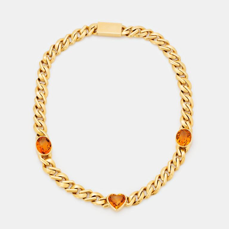 An 18K gold necklace set with faceted citrines.