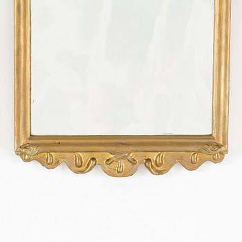 A rococo mirror, 18th century.