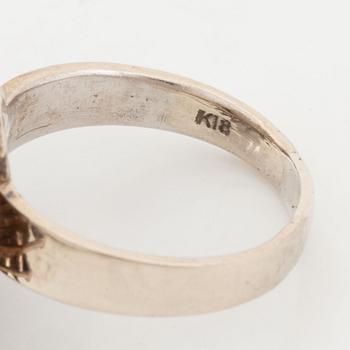 A pearl and diamond ring.