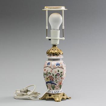 A 20TH CENTURY FAIENCE LAMP.