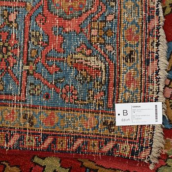 A carpet, an antique/semi-antique Heriz, ca 352 x 275 cm.