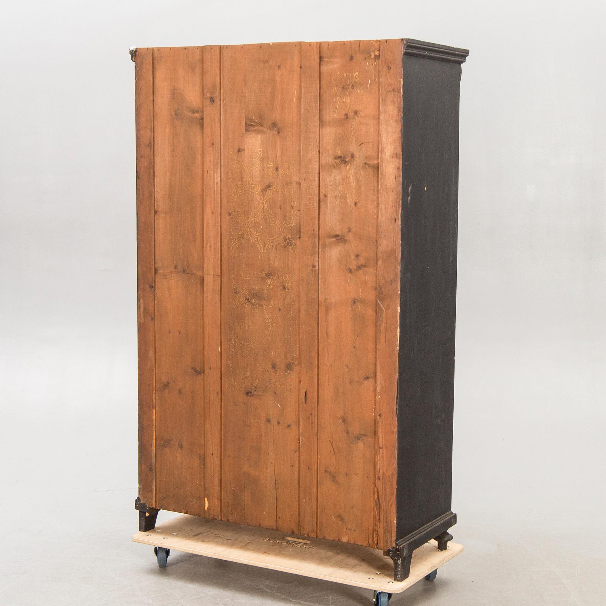 A painted early 1900s display cabinet.
