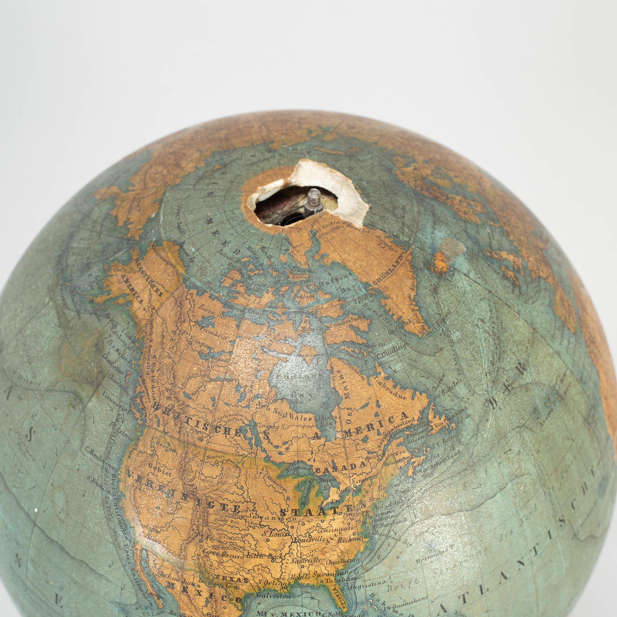 A miniature terrestrial globe, marked Adami Berlin Verlag von Dietrich Reimer 1856,