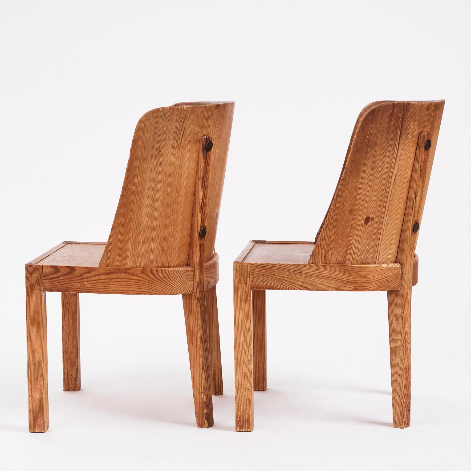 Axel Einar Hjorth, a pair of "Lovö" stained pine armchairs, Nordiska Kompaniet 1930s.