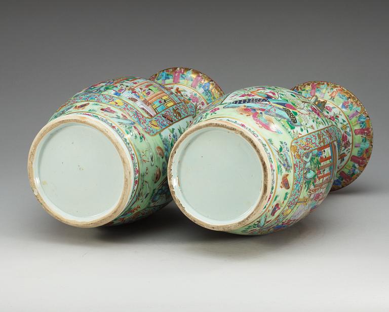 A pair of famille rose Canton vases, Qing dynasty, 19th Century.