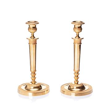 A pair of French Empire candlesticks, early 19th century.