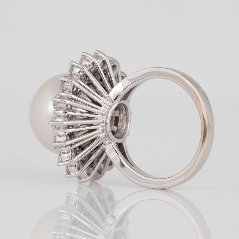A cultured South Sea pearl and diamond ring.