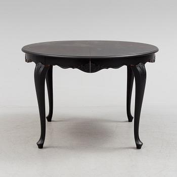 A mid 20th century rococo style dining table.