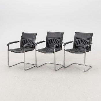 A set of five chrome and leather armchairs alter part of the 20th century.