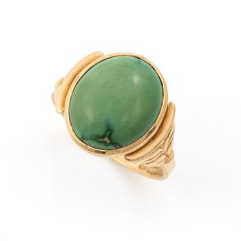 18K gold ring with green stone.