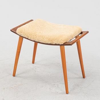 A teak stool with new sheepskin upholstery, 1960s.