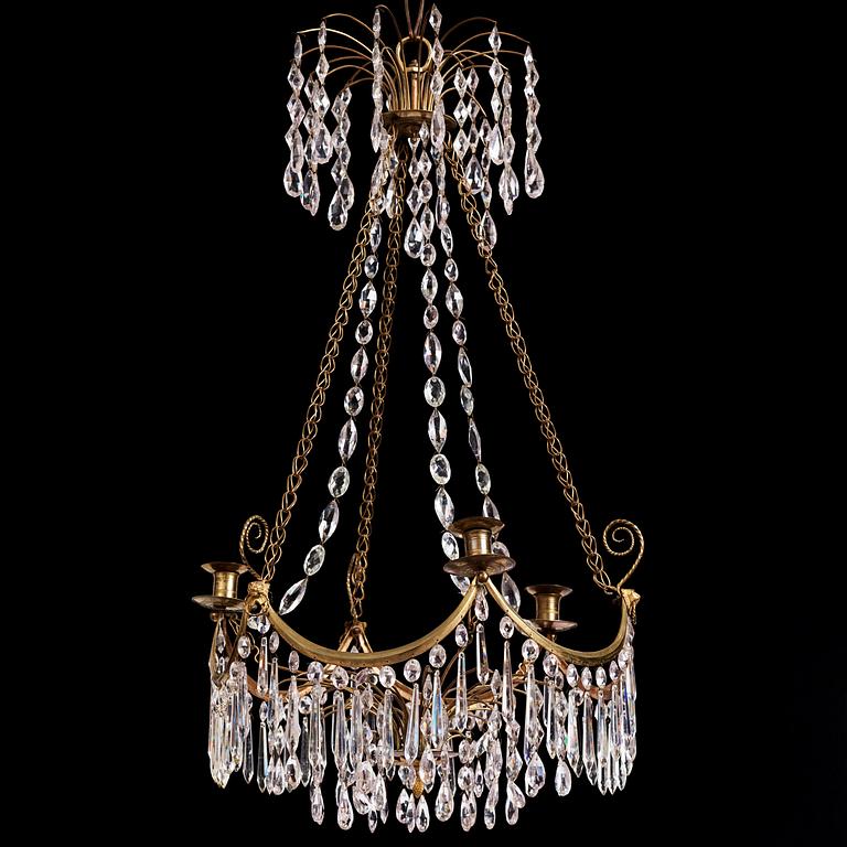 A Gustavian gilt brass and cut glass four-light chandelier, Stockholm, late 18th century.