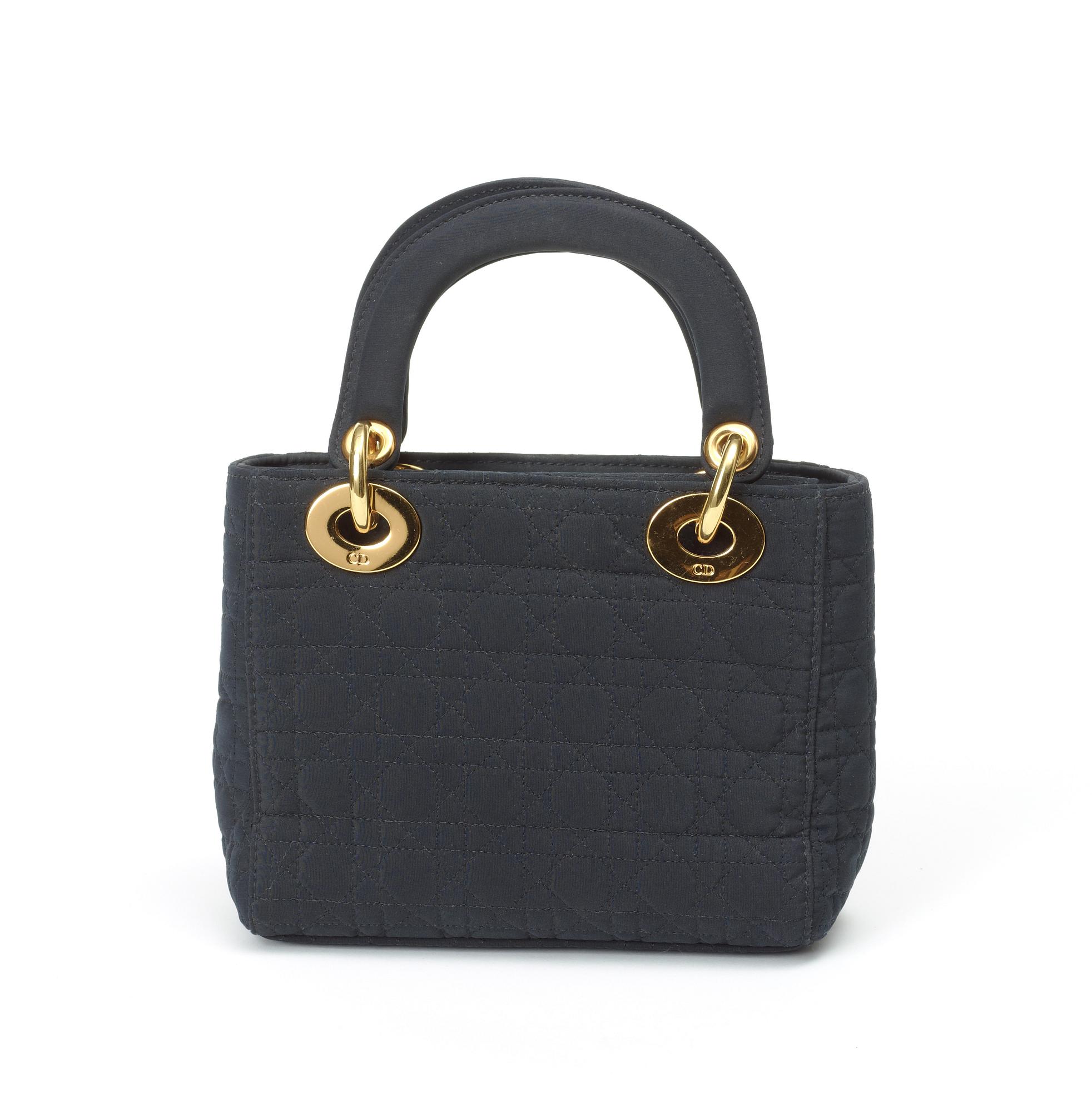 A black quilt silk evening bag by Christian Dior.
