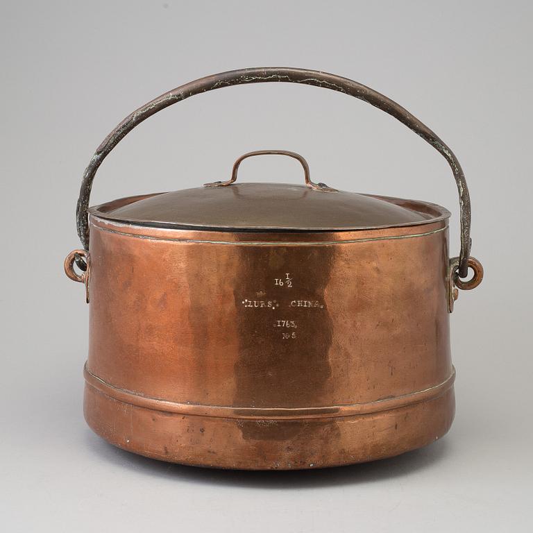 A 18th century copper cauldron.