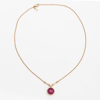 Pandora, a necklace with a lead glass treated ruby.