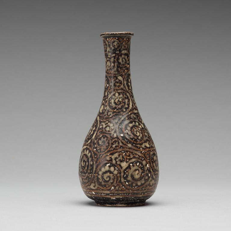 A black glazed sgrafitto vase, presumably Song dynasty (960-1279).